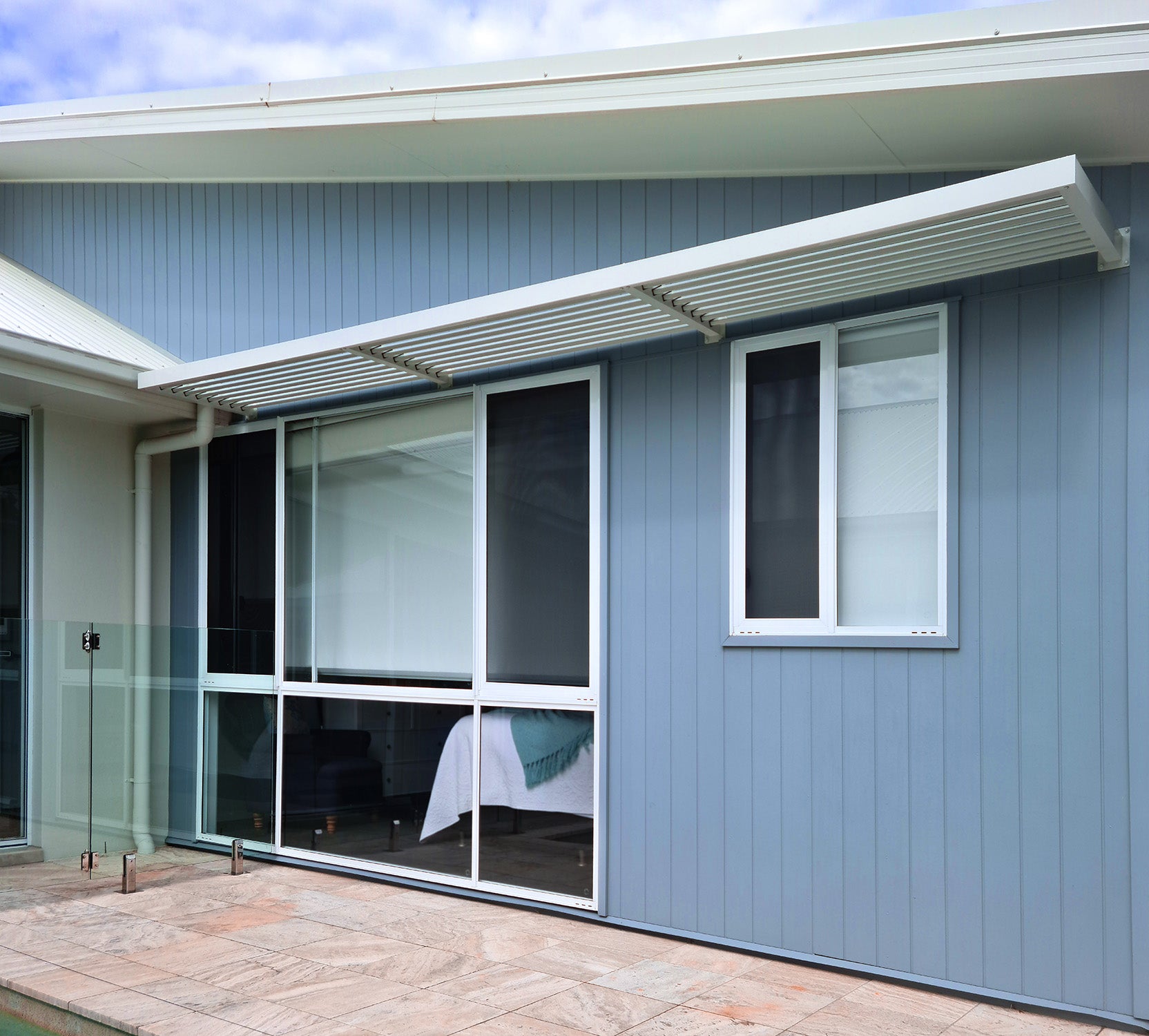 Window Awnings in pearl white aluminium powder coat with louvre blades