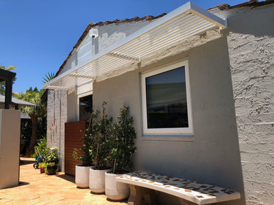 Pearl White outdoor window awnings in louvre style DIY flat packed to Perth