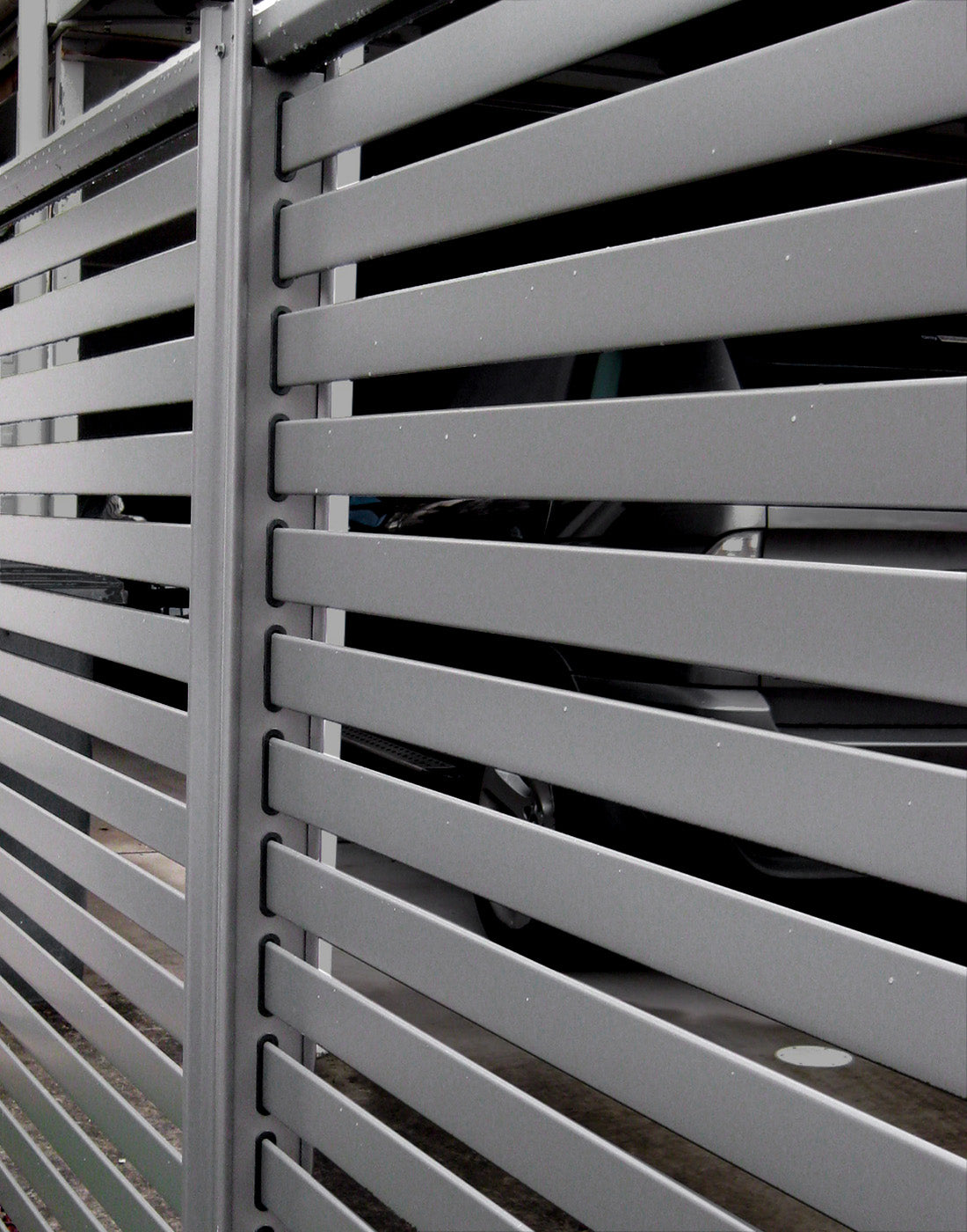 Slat fence guarding a house