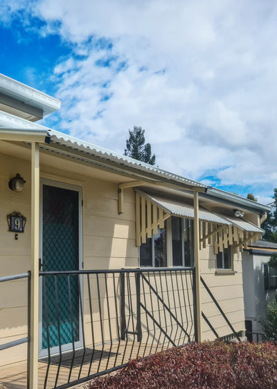 Grey and Cream Cottage with Heritage style COLORBOND Window Hoods