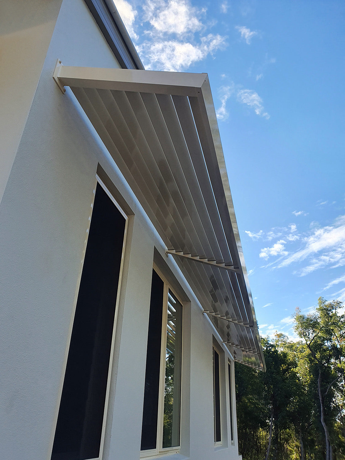 Extra long Aluminium Louvre Awning at 20° Angle in Dune powder coat from the Clik'n'Fit collection