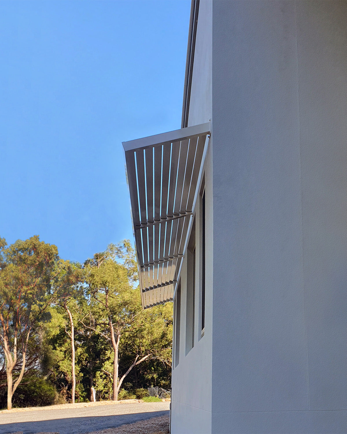 Clik'n'Fit Louvre Aluminium Awning at a 20° Angle in Dune powder coat.